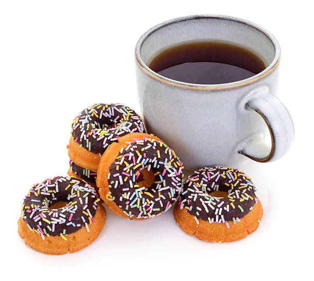 istock Cup of coffee with chocolate donuts and colorful sprinkles 2244660640