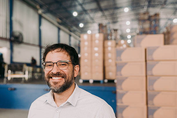 istock Supervisor smiling at industrial warehouse 2244662912