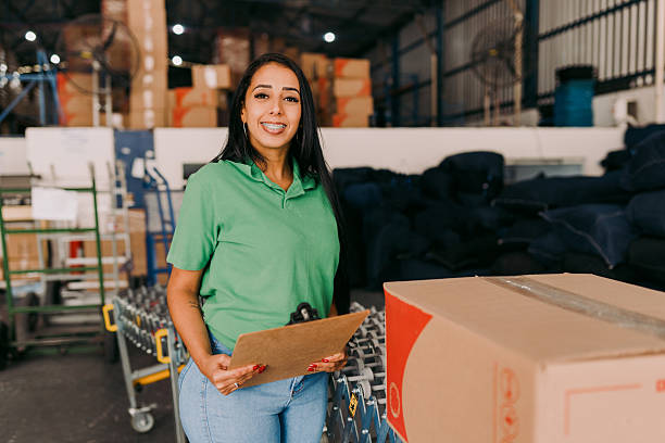 istock Female employee with clipboard at warehouse 2244662934