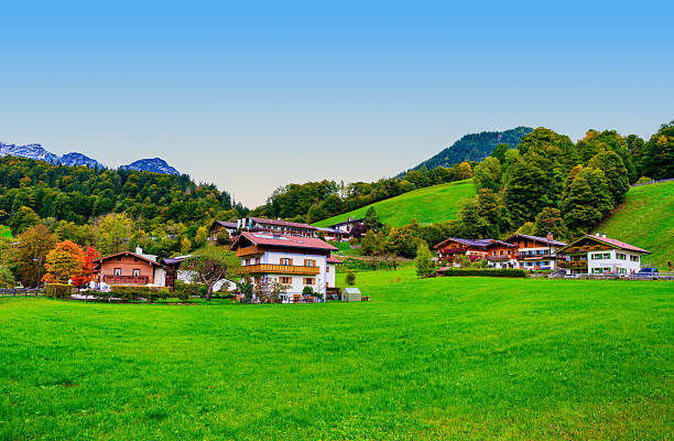 istock Alpine half-timber houses on lush rolling hills, Ramsau bei Berchtesgaden, Germany 2244664415