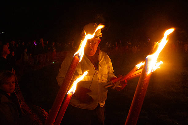 Cranleigh, Surrey, United Kingdom - November 1st 2025: Cranleigh Bonfire Night, Guy Fawkes Night event, people marching in the fire torch parade
