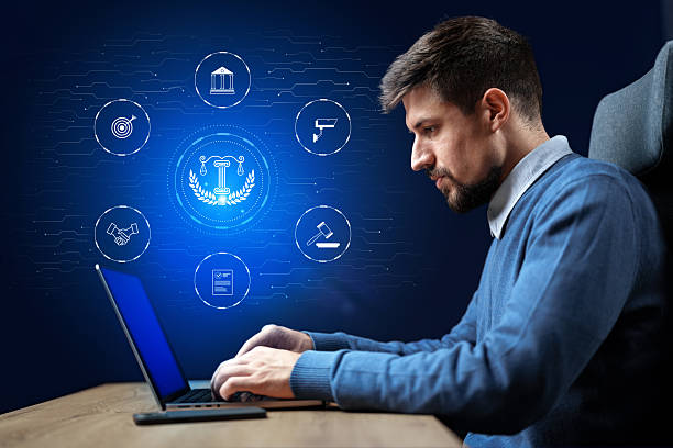 istock Professional man working on laptop with digital icons representing law and technology concepts 2244666274