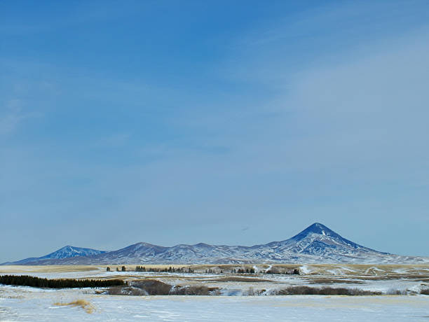 istock Snowy Sweet Grass Hills Under a  Blue Sky 2244666466