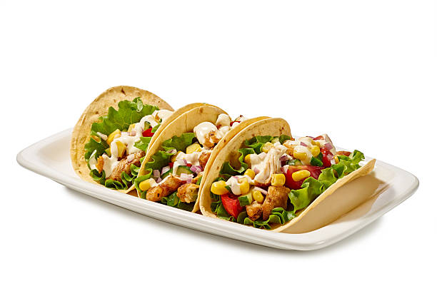A Plate of Delicious Tacos Stuffed with Fresh Ingredients and Unique Flavor Combinations