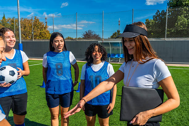 istock Coach explaining soccer strategy to female team 2244672441