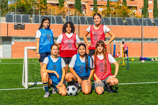 istock Diverse women soccer team posing on field after training 2244672595