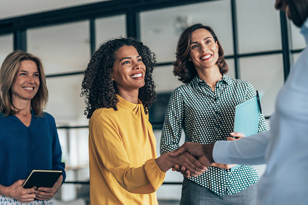 istock Business people shaking hands in the office 2244679122