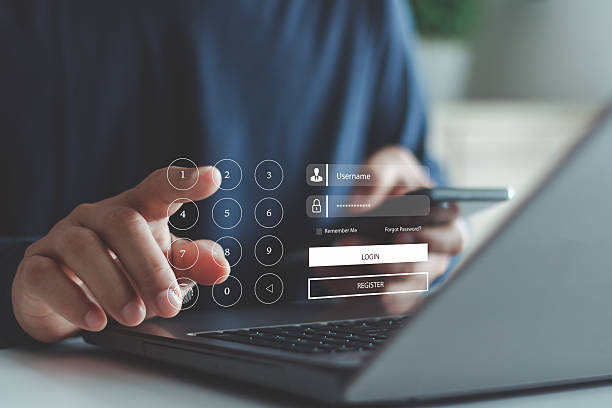 istock User entering PIN and password on digital login interface using laptop and smartphone, representing secure authentication, online registration and cybersecurity protection for digital identity access. 2244682767