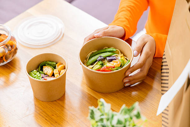 istock Asian woman eating lunch 2244683714