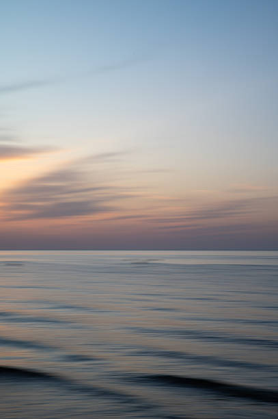 istock Artistic Blurred Background of Sea, Sky and clouds during a soft colours sunset. Copy space. 2244683856