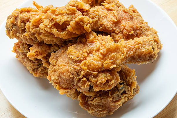 istock Crispy fried chicken in white plate on wood table 2244688463