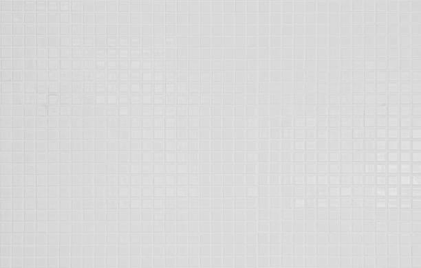 istock White tile wall background texture. Ceramic brick wall and floor tiles mosaic background in bathroom. 2244688504