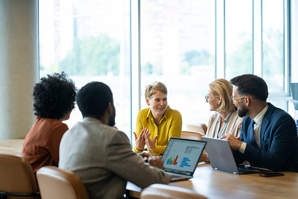 istock Business people collaborating on project in modern office 2244690289