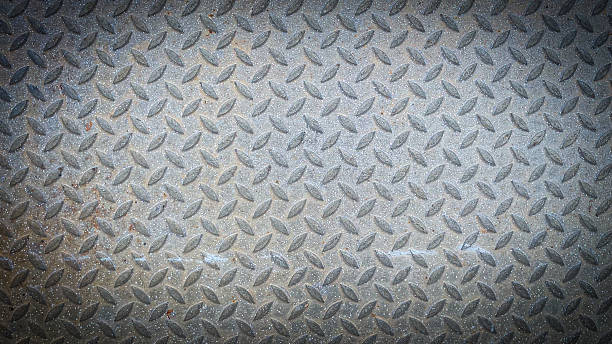 istock Industrial metal checker plate texture background featuring raised diamond patterns, 2244696137