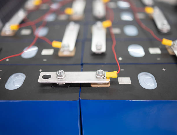 istock Technician is connect LiFePO4 batteries in series for off-grid solar system. 2244696197