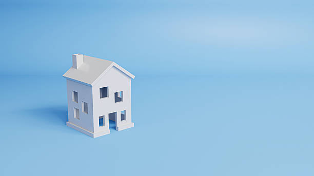 istock Minimal style house on a blue background with copy space, symbolizing home buying, housing loans, and modern living concepts. 3d rendering 2244696518