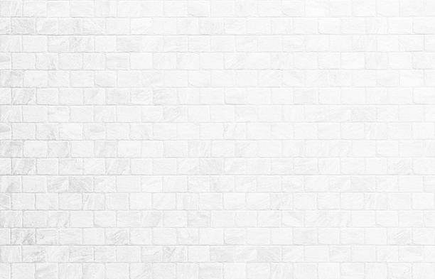 istock Close up modern white brick tiles wall texture background. 2244698973
