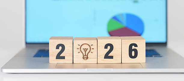 istock 2026 Year block with lightbulb icon against computer laptop background. Business Idea, Creative, Thinking, brainstorm, Goal, Resolution, strategy, plan, Action, change and New Year start concepts 2244700240
