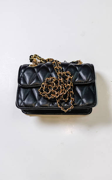istock black women's fashion bag on a white background 2244700271
