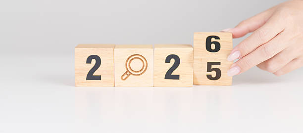 istock 2025 year change to 2026 year block with magnifying glass icon. SEO, Search Engine Optimization, hiring , Advertising, Idea, Strategy, marketing, Keyword, Content and New Year start concepts 2244700272