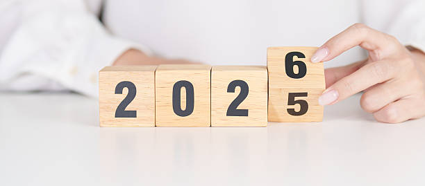 istock 2025 change to 2026 year block on table. goal, Resolution, strategy, plan, start, budget, mission, action, motivation and New Year concepts 2244700423