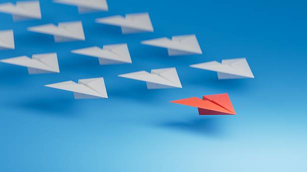 istock Different business concept.new ideas. paper art style. creative idea.Leaderplane concept, blue leader plane leading white planes.3D rendering on blue background. 2244700591