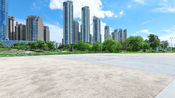 istock Empty square floor with modern urban skyline and sunny blue sky background 2244700598