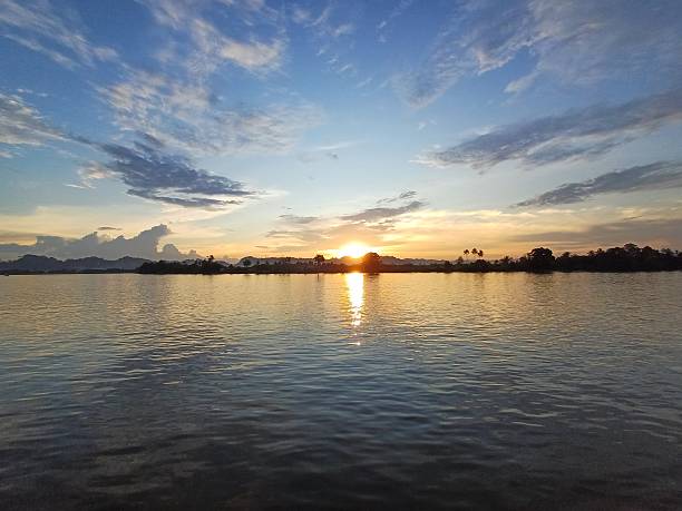 istock Golden Sunset Reflections Over Peaceful River Waters 2244701047