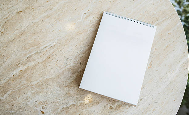 istock Mockup desk calendar on marble table background. 2244701517