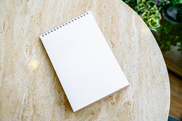 istock Mockup desk calendar on marble table background. 2244701519