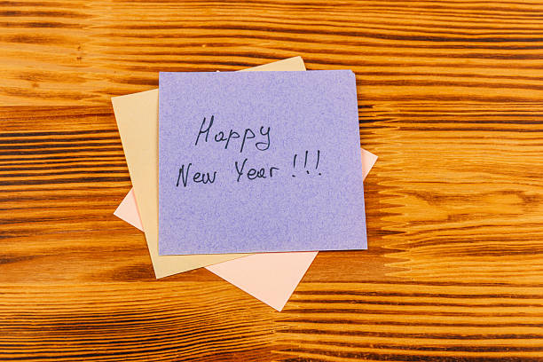 istock Happy New Year handwritten note on colorful sticky notes on wood 2244707751