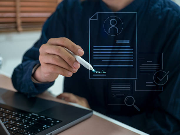 istock Businessman using digital pen to sign online document on virtual screen, symbolizing e-signature, online contract, and paperless business process. Concept of digital agreement and secure workflow. 2244709527