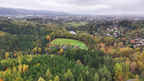 istock developed community situated beside wooded boundary with vibrant fall foliage and curved pathways 2244711677