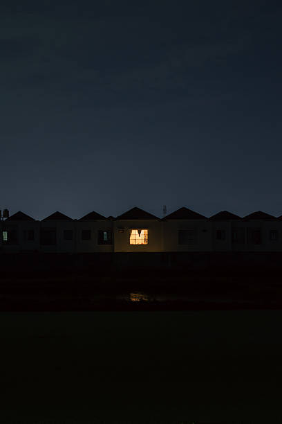 istock Residential Houses at Night with Lit Window 2244711806