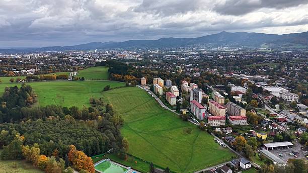 istock spectacular aerial perspective capturing lively apartment row with natural backdrop and dramatic sky 2244712165