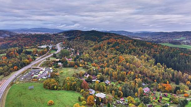 istock peaceful rural scenery, tranquil rural community surrounded by vibrant autumn trees and open fields 2244714682
