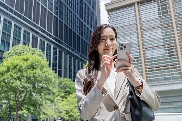 istock Asian businesswoman using smartphone 2244715275