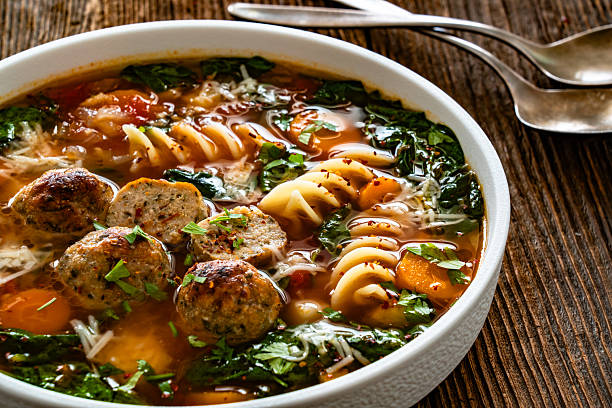 istock Italian Meatballs Wedding Soup on wooden table 2244715366