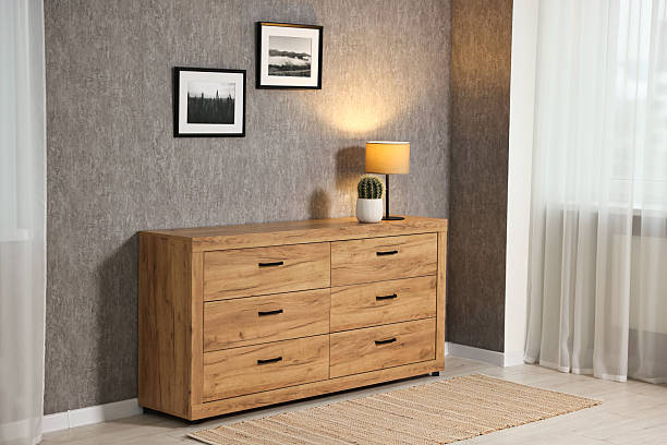 Vertical front view of a natural wood, rustic small chext of drawers in the American Southwest furniture style. Cut out and isolated on white background. 