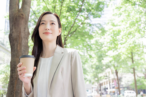 istock Asian businesswoman ordering takeout coffee 2244716432