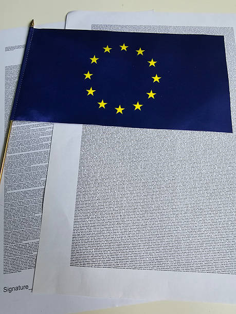 istock Collection of European Union documents with a small EU flag 2244716819