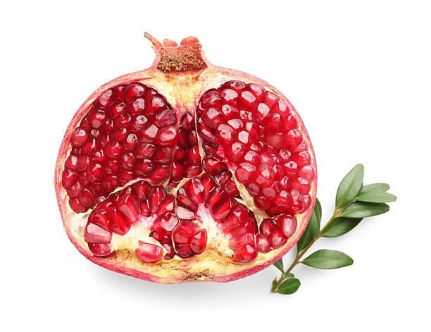 istock Half of fresh pomegranate and branch isolated on white, top view 2244717234