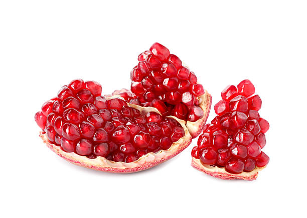 istock Piece of fresh pomegranate isolated on white 2244717276