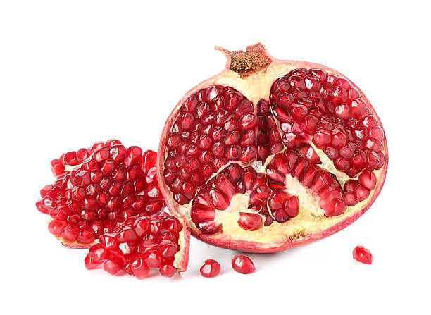 istock Fresh cut pomegranate with juicy seeds isolated on white 2244717310
