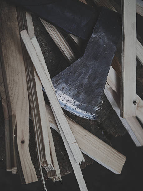 An Australian house wood pile and firewood splitting area with small hatchet axe