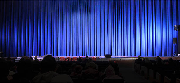 istock Closed blue curtains on a big stage 2244718195