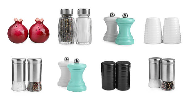 Different salt and pepper shakers isolated on white, set