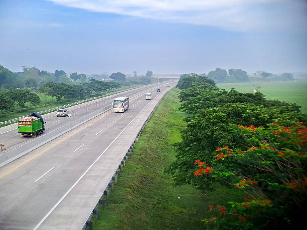 istock A view from a high vantage point captures vehicles driving along an expansive highway amid greenery. 2244719618