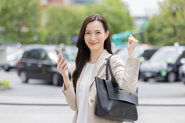 istock Asian businesswoman using smartphone 2244719753