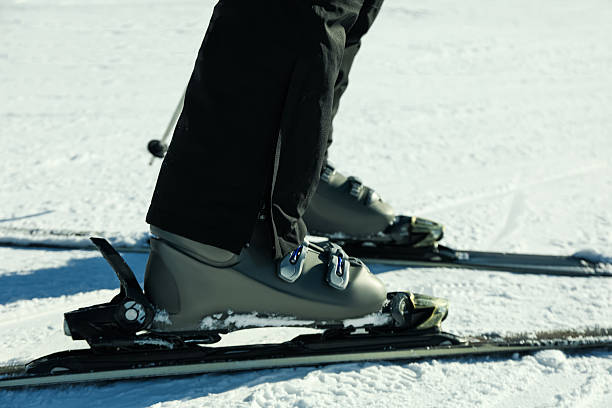 istock Skier legs on ski slope, ski season 2244721715